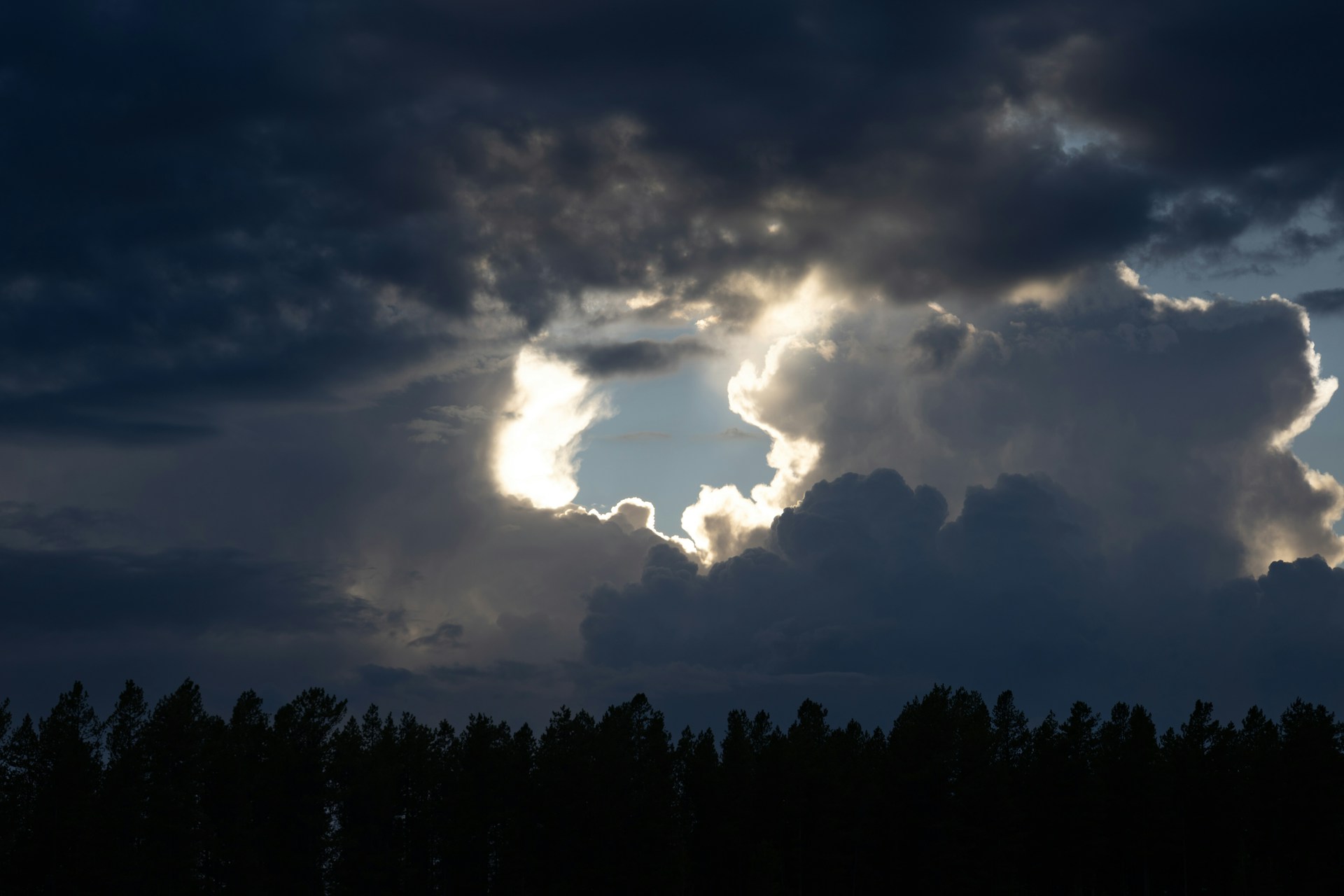 Photo by <a href="https://unsplash.com/@vincentyuan87?utm_source=unsplash&utm_medium=referral&utm_content=creditCopyText">Vincent Yuan @USA</a> on <a href="https://unsplash.com/photos/sunlight-breaks-through-dark-storm-clouds-over-trees-FyX4YHkJDGY?utm_source=unsplash&utm_medium=referral&utm_content=creditCopyText">Unsplash</a>
      